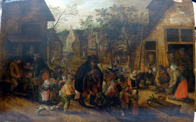 Village street with blind hurdy-gurdy player by David Vinckboons