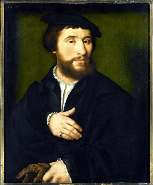 Man dressed in black holding gloves by Joos van Cleve