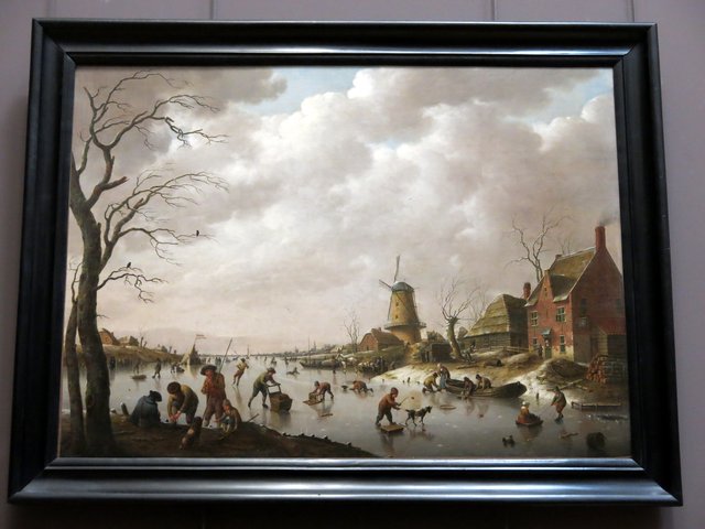 Skaters on an icy canal by Hendrik Willem Schweickhardt