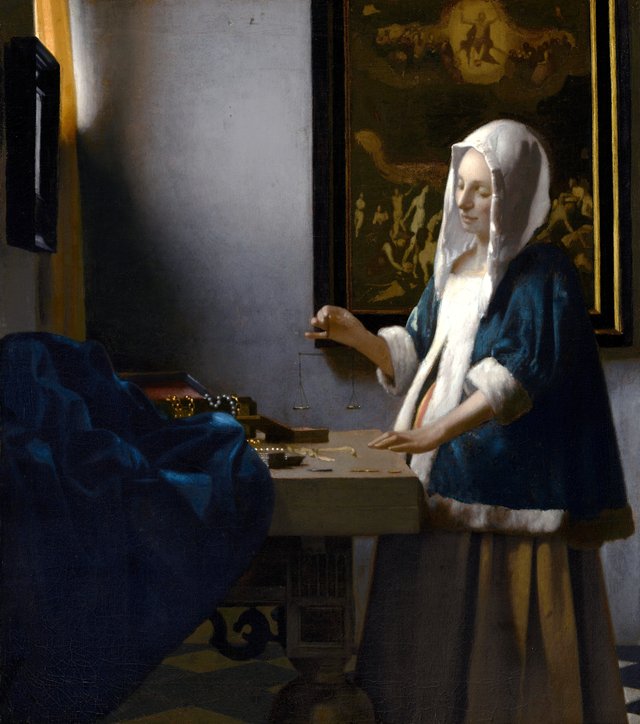 Woman Holding a Balance by Johannes Vermeer