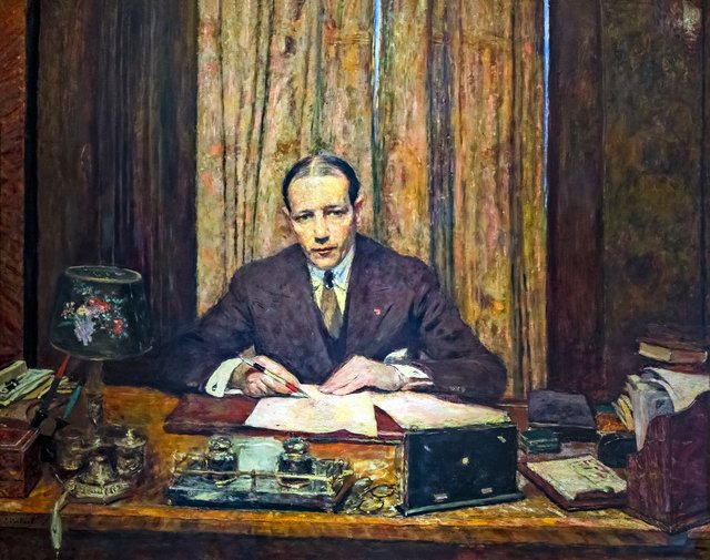 Lucien Rosengart at his work table by Édouard Vuillard