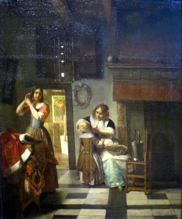 Two women and a child,  'A Mother's Care' by Pieter de Hooch