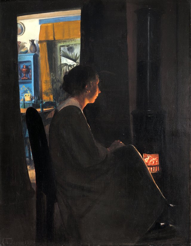 Skumring. Kunstnerens hustru ved kakkelovnen by Laurits Andersen Ring