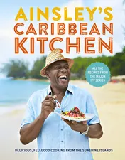 Omslag van Ainsley's Caribbean Kitchen Delicious feelgood cooking from the sunshine islands. All the recipes from the major ITV series