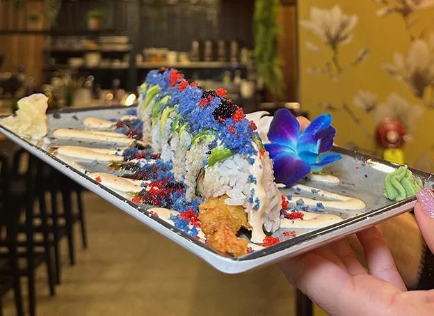 A closeup of a sushi roll on a plate