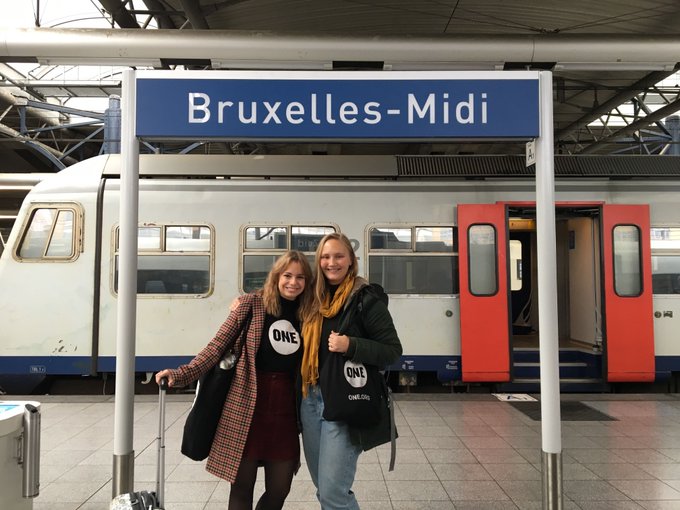 Two young women at a train station