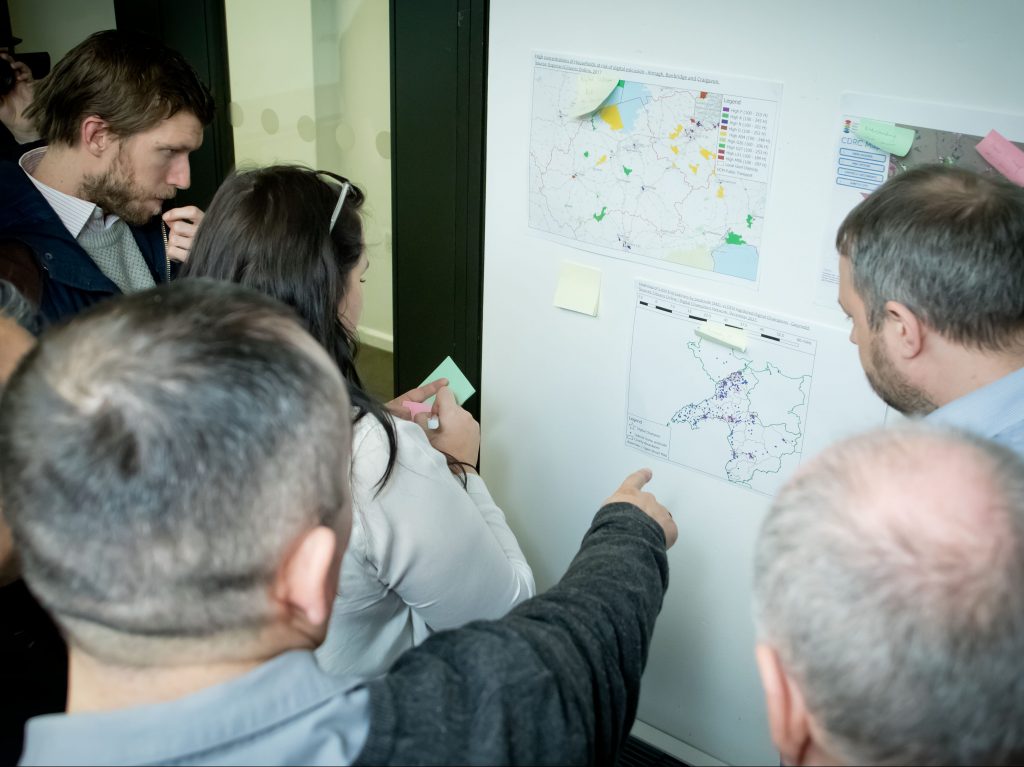 Image: Photo of people planning ideas on a whiteboard