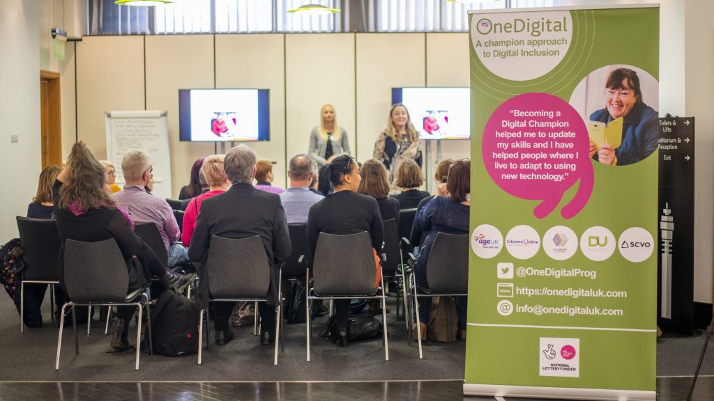 Event workshop with One Digital banner in foreground