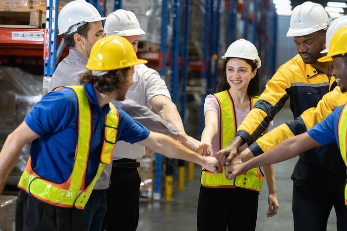 Team of workers working in warehouse