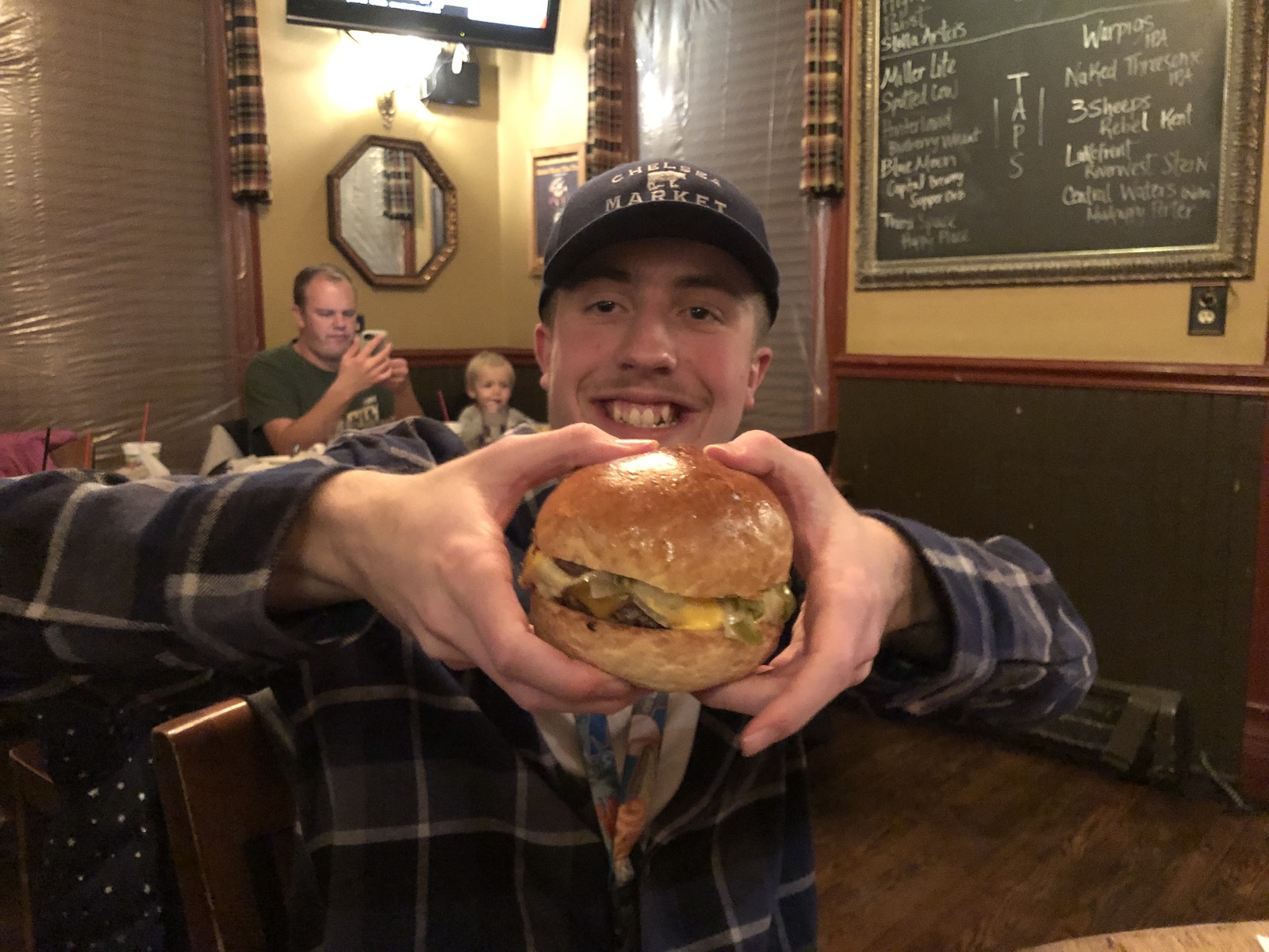 Dominic with a burger