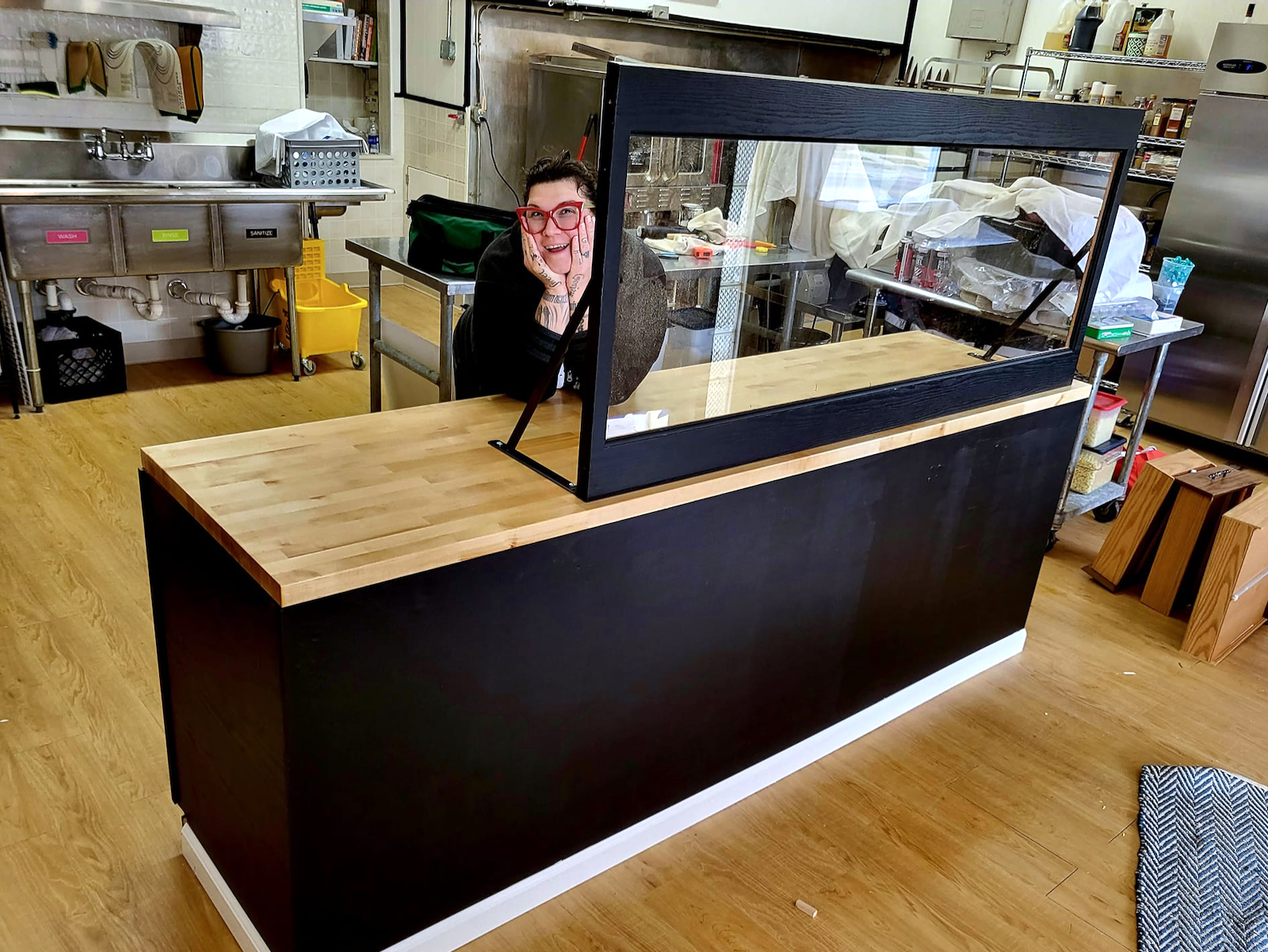 Mironczuk behind her chalk-paint counter