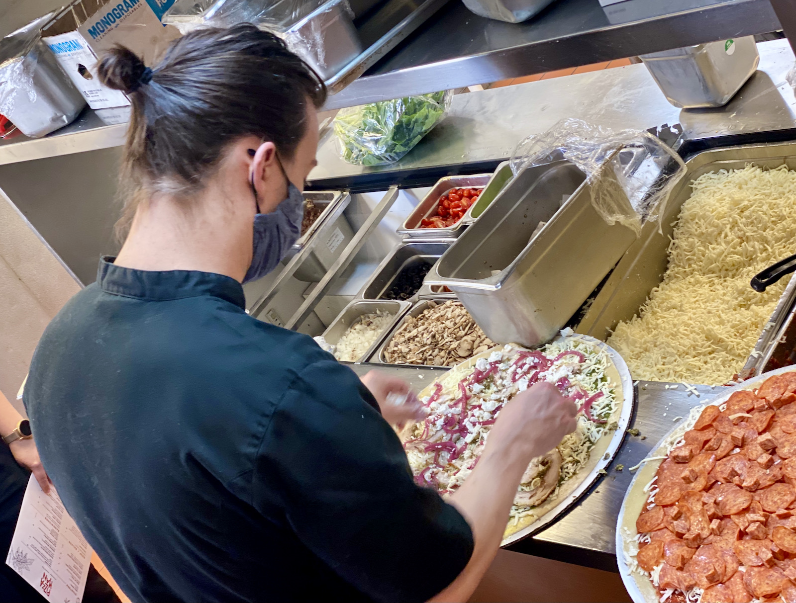 Jesse Wendel making pizzas