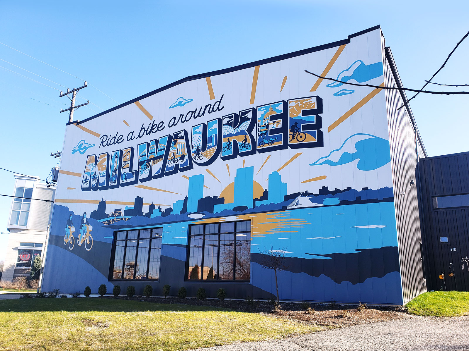 The new building sits on Robinson Ave., just off of Kinnickinnic Ave. and Becher St. in Bay View. The northern facade displays a massive mural declaring âRide a bike around Milwaukee.â