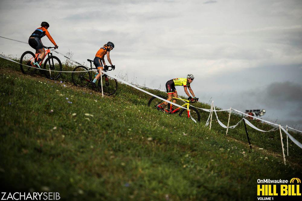 Three cyclocross racers descend a tricky switchback.