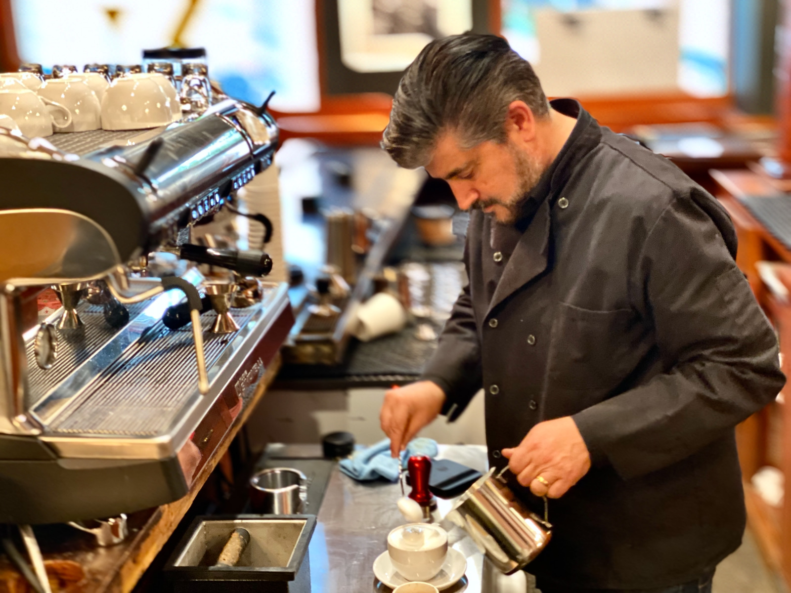 Tommy Orlando making a cappuccino