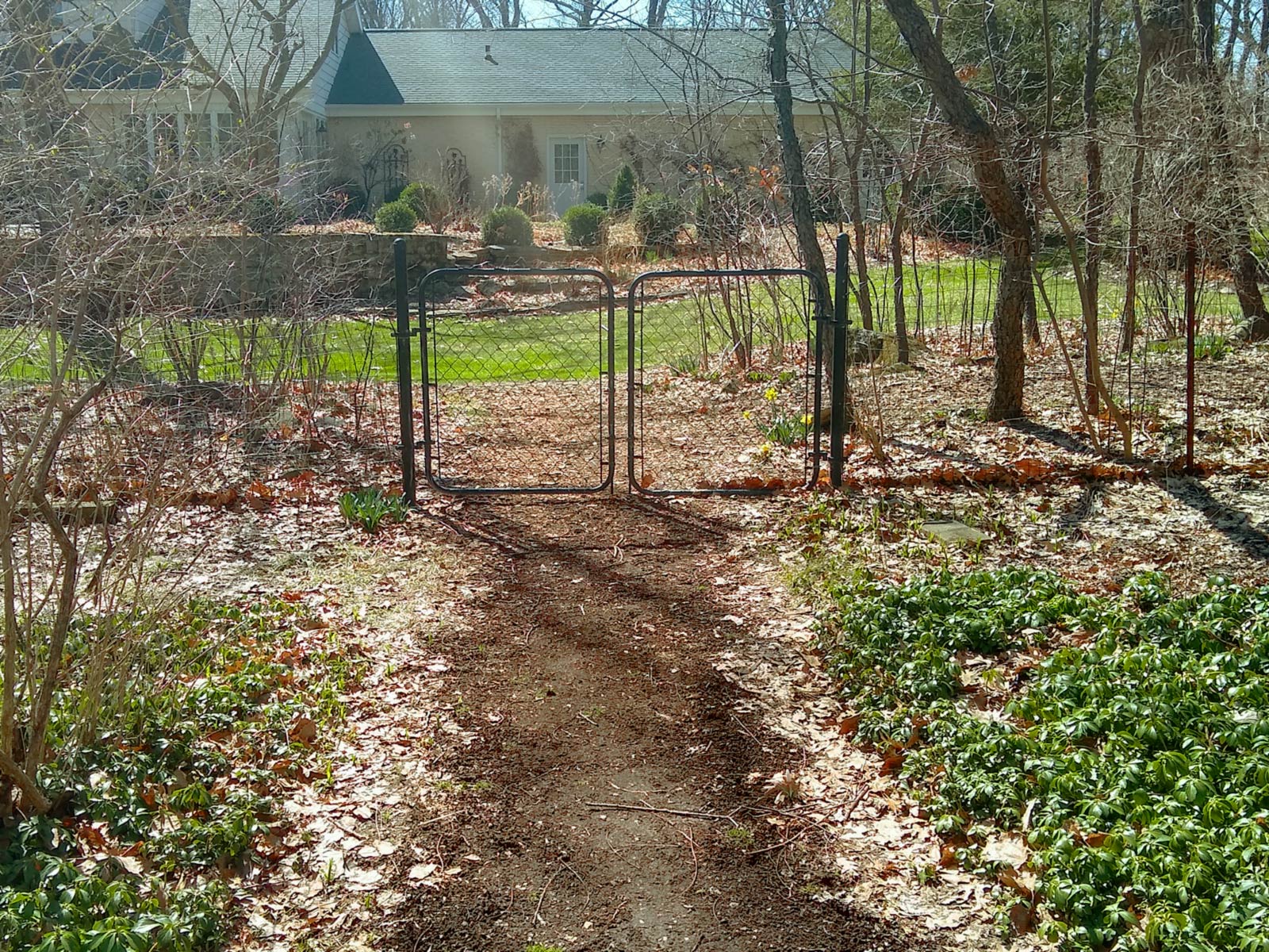 A landscaped, manicured dirt path dug into public land.