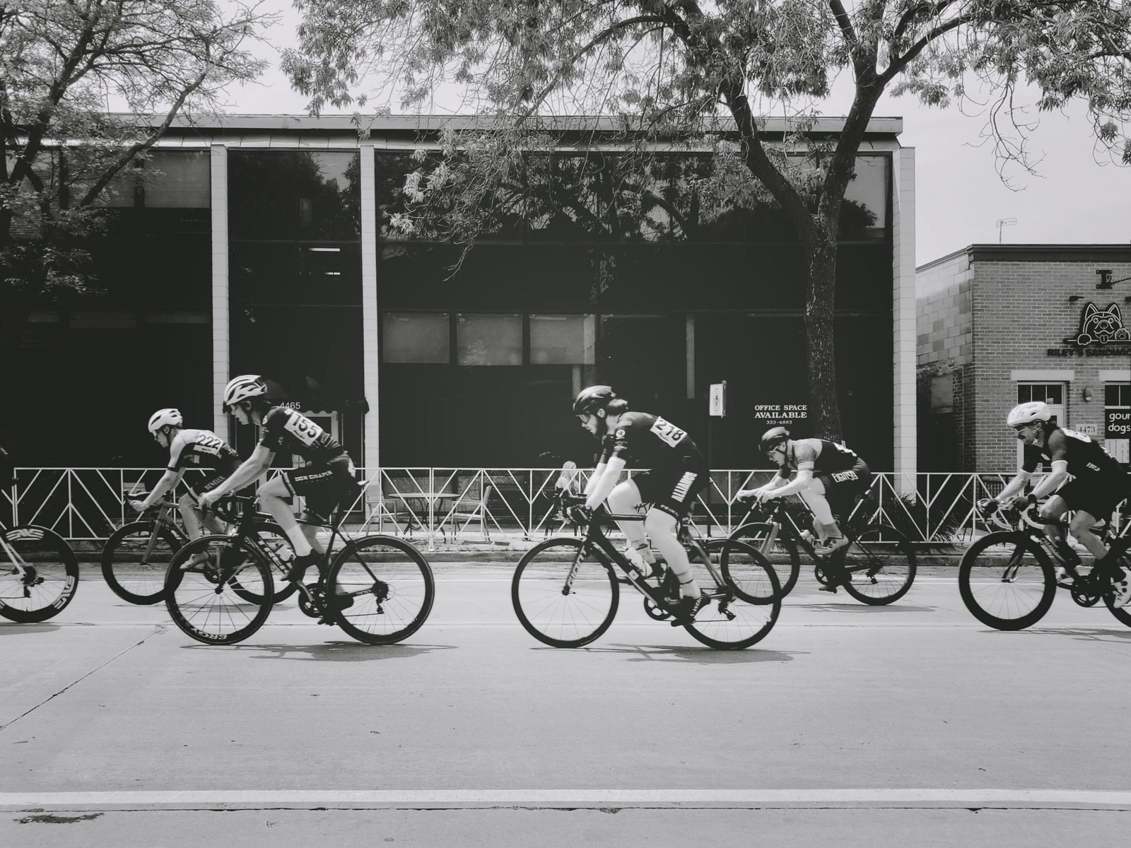 Bike racers in Shorewood at the Tour of America's Dairyland in black and white.