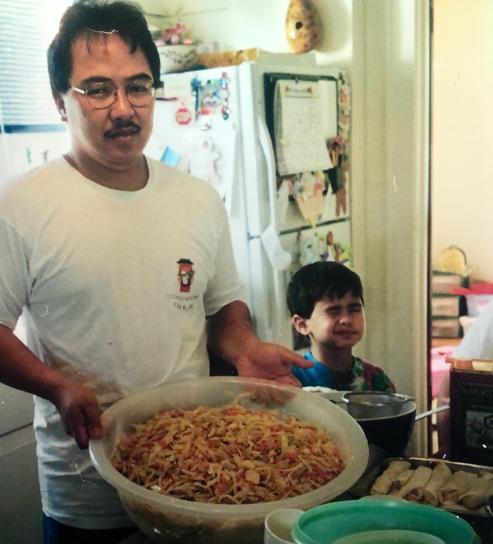 Ray Alfaro and Matthew making pancit and lumpia