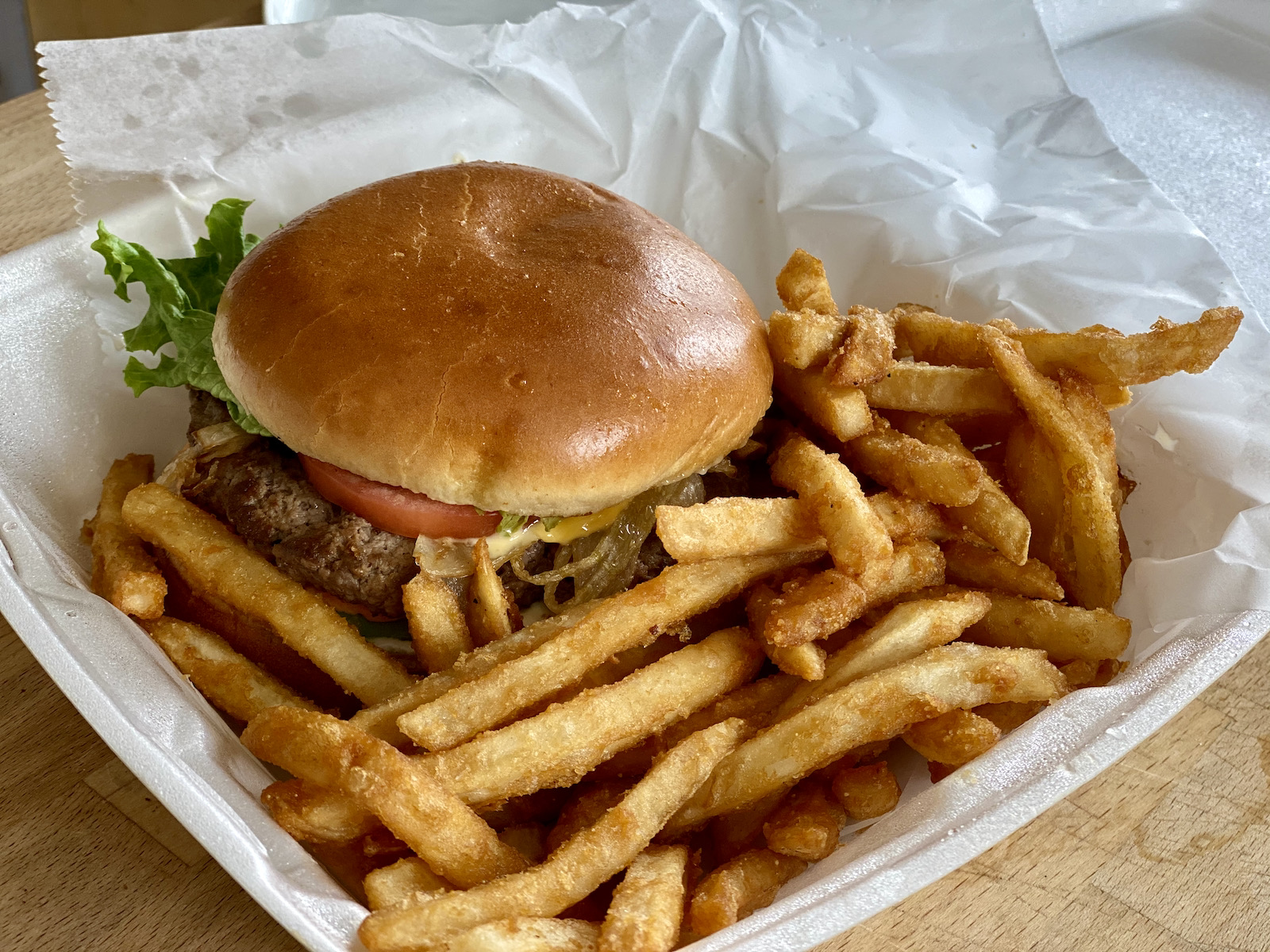 The Piaza Burger inside its styrofoam container