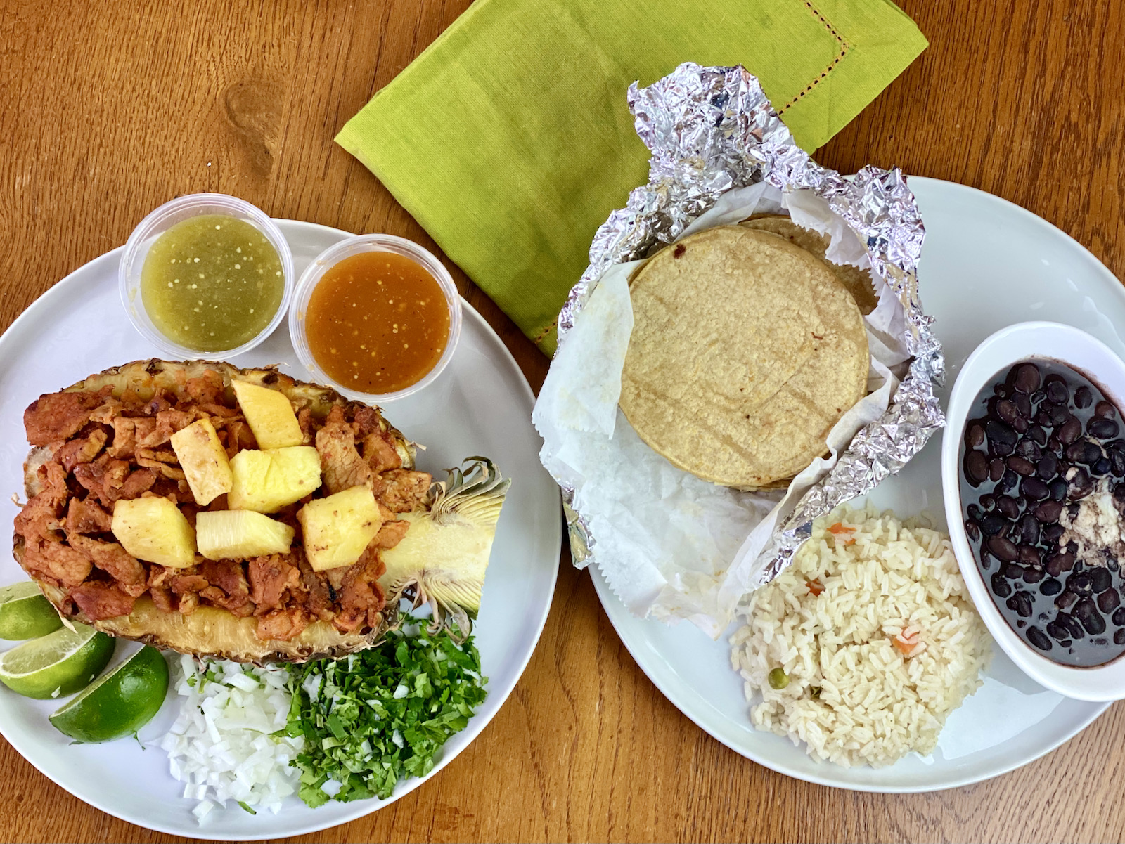 al pastor displayed in a roasted pineapple half