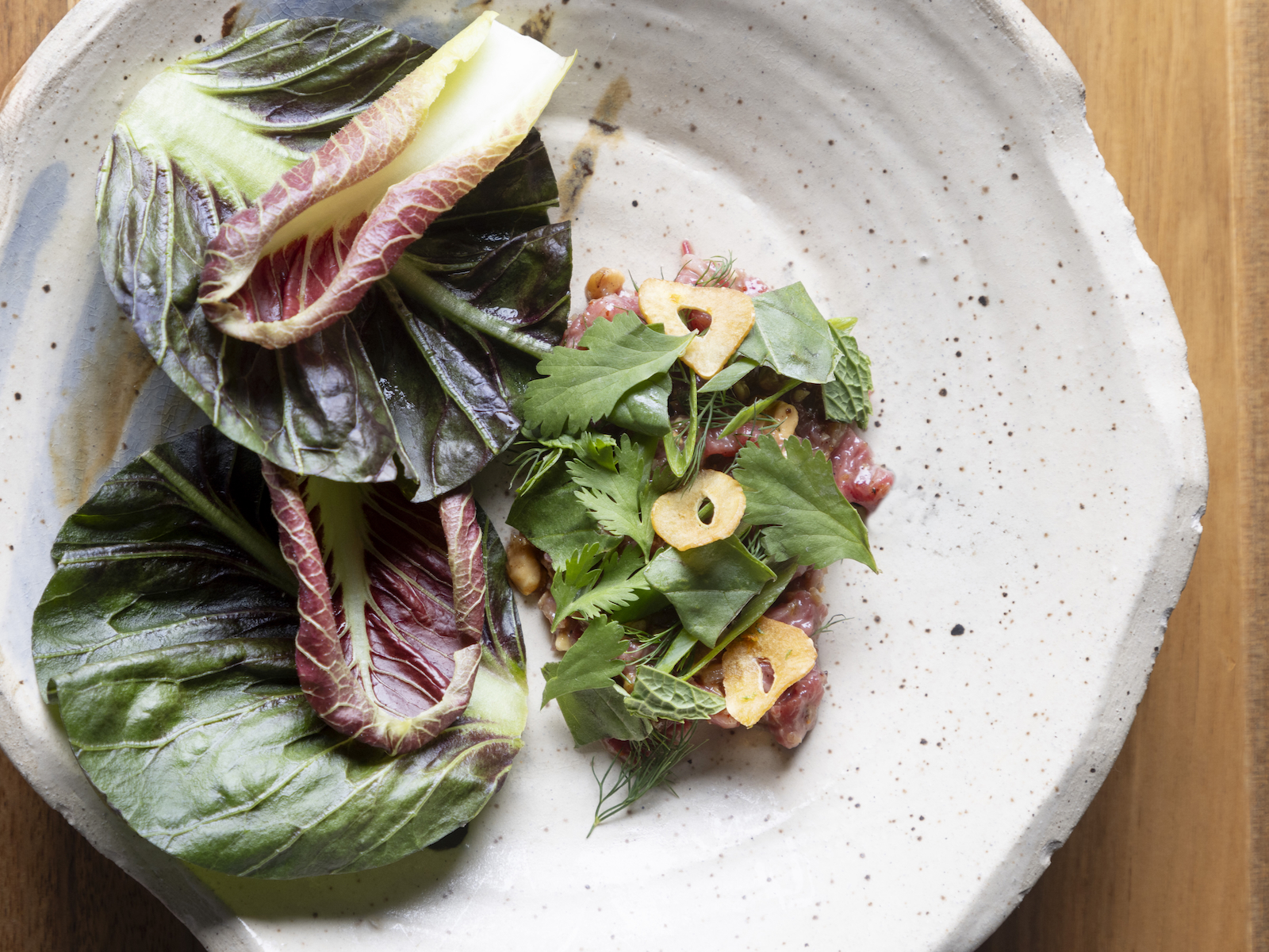 Beef tartare: served with herbs and lettuce