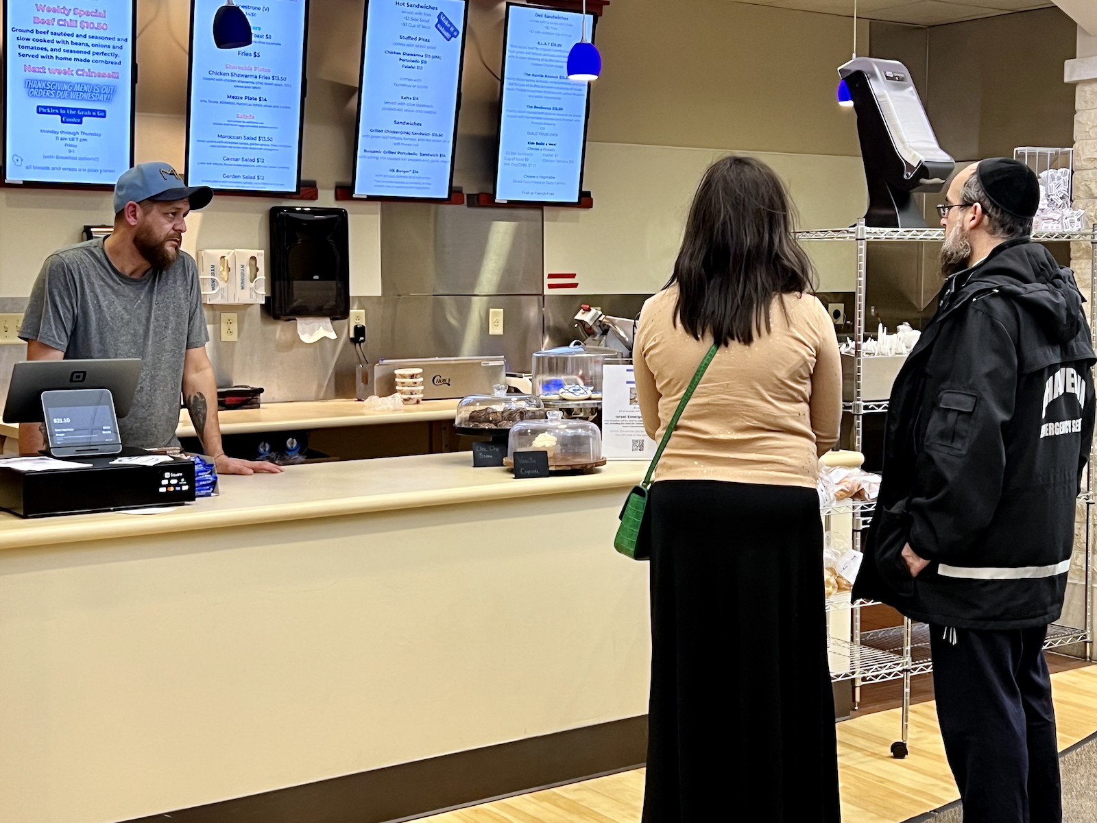 Folks waiting in line at cafe