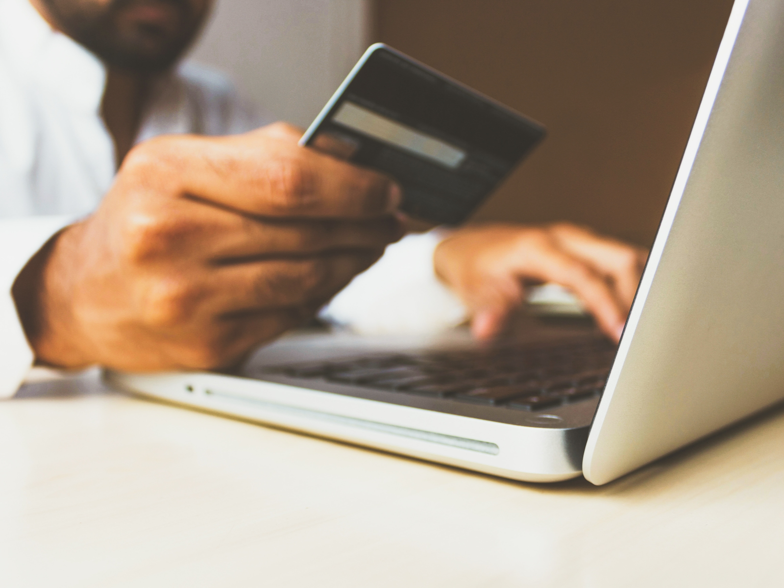 Man with credit card and laptop