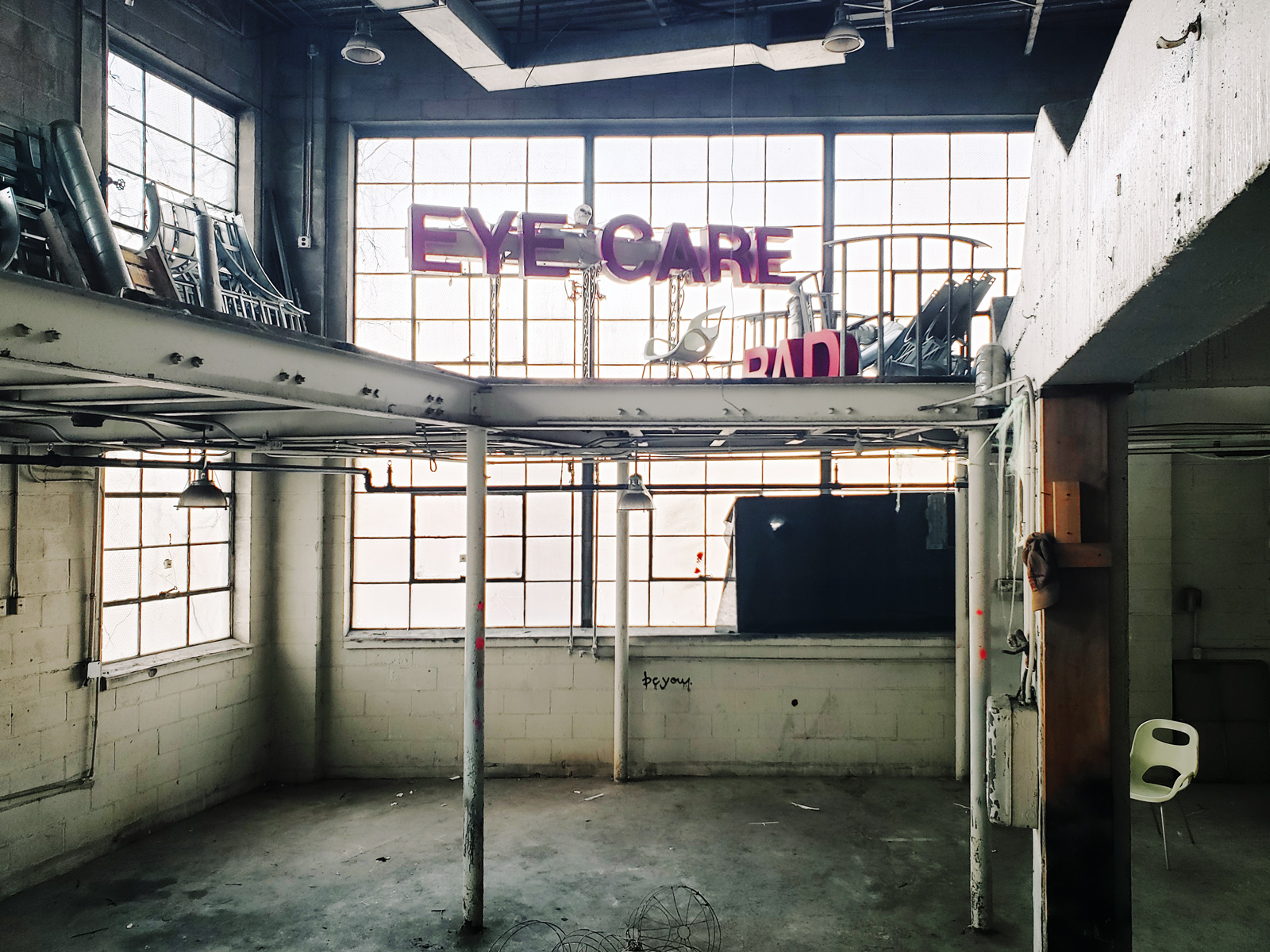 A small room with massive windows and a balcony, that may soon be transformed into a speakeasy.