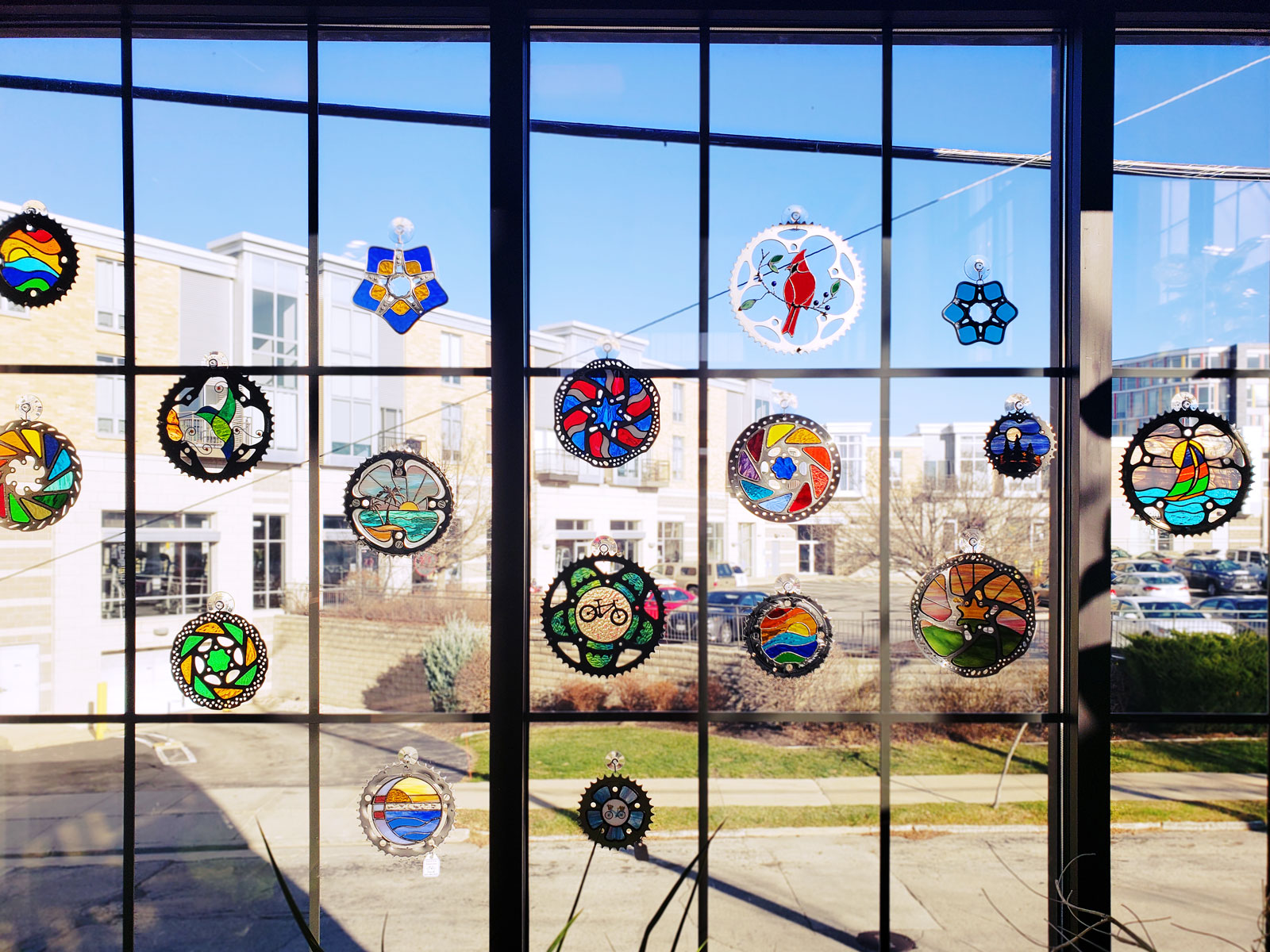 These stained glass window decorations were made from recycled bike parts and will be for sale in the gift shop.