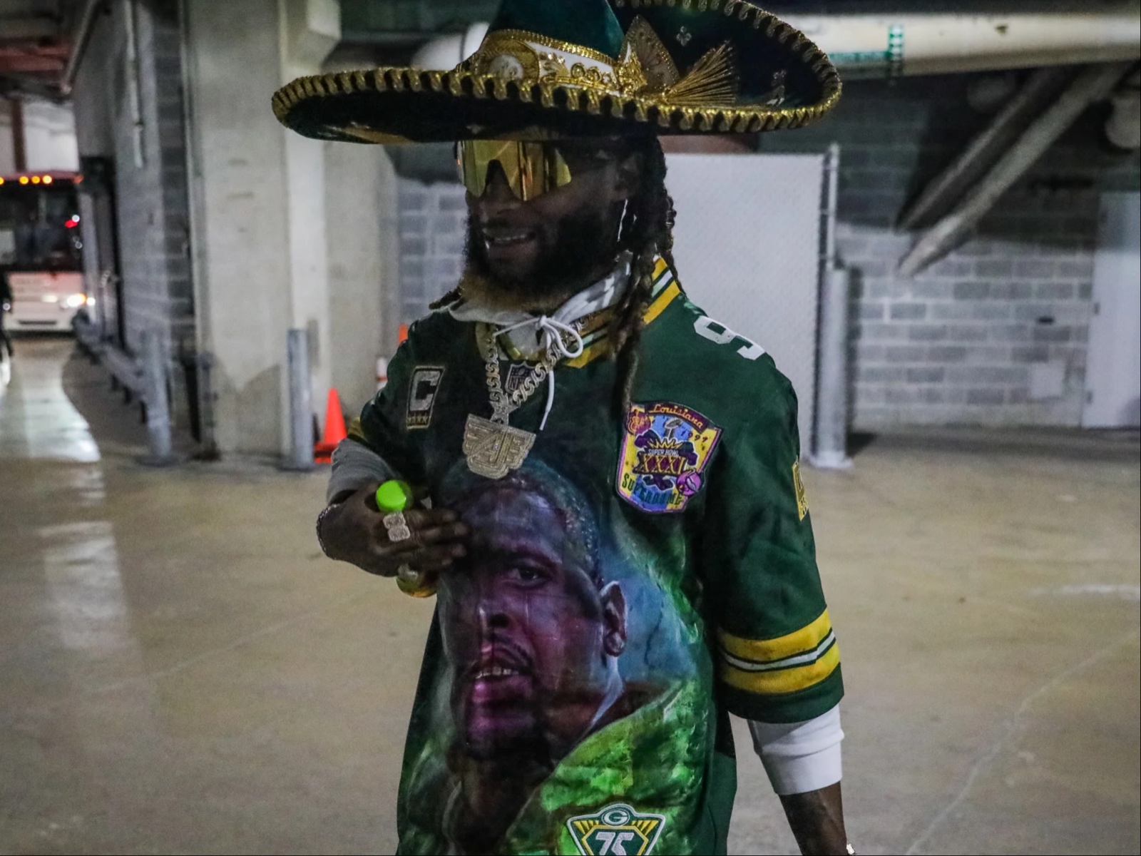 A fan puts his sombrero on Green Bay Packers running back Aaron