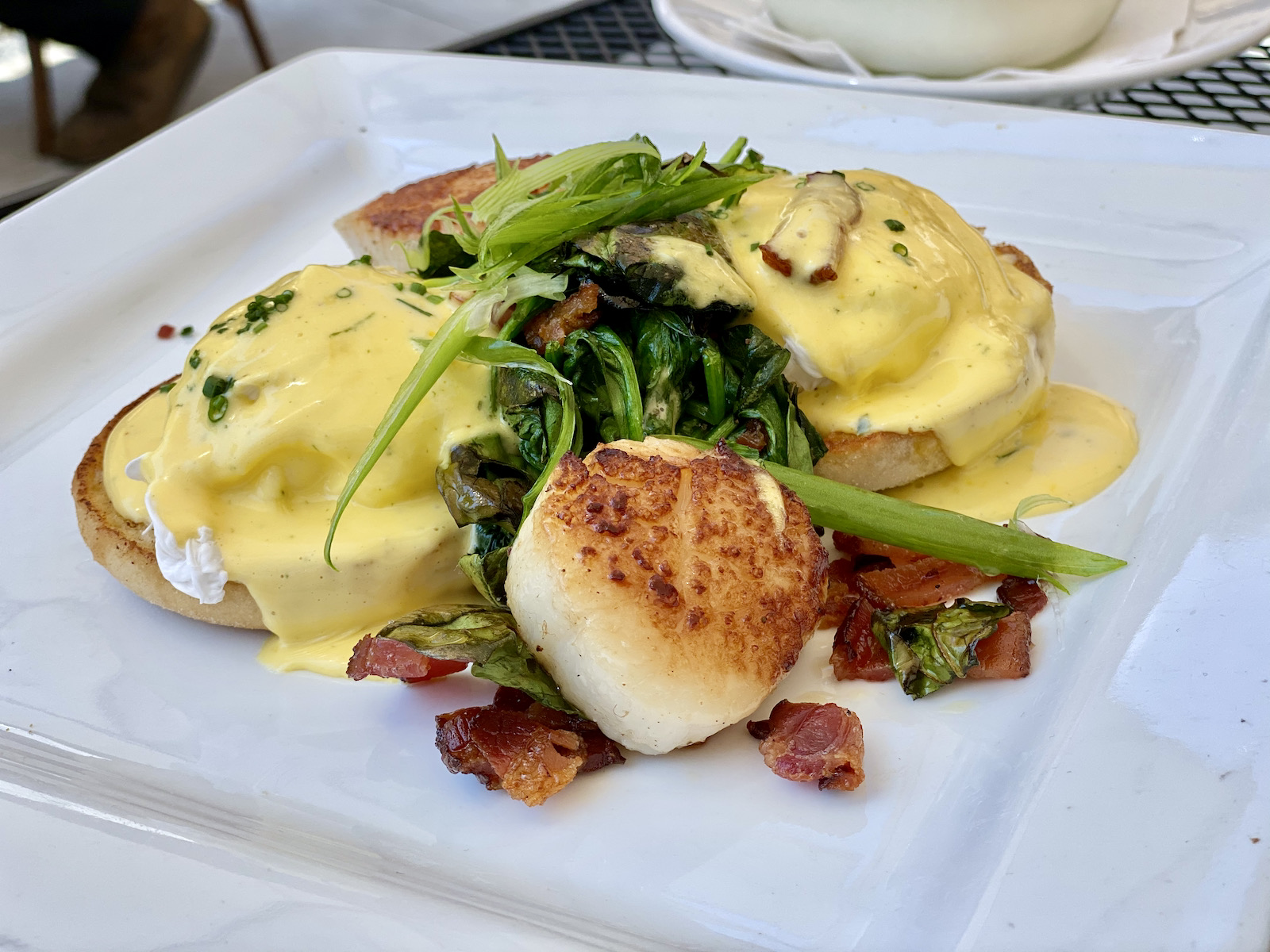 Scallops Benedict with spinach and bacon