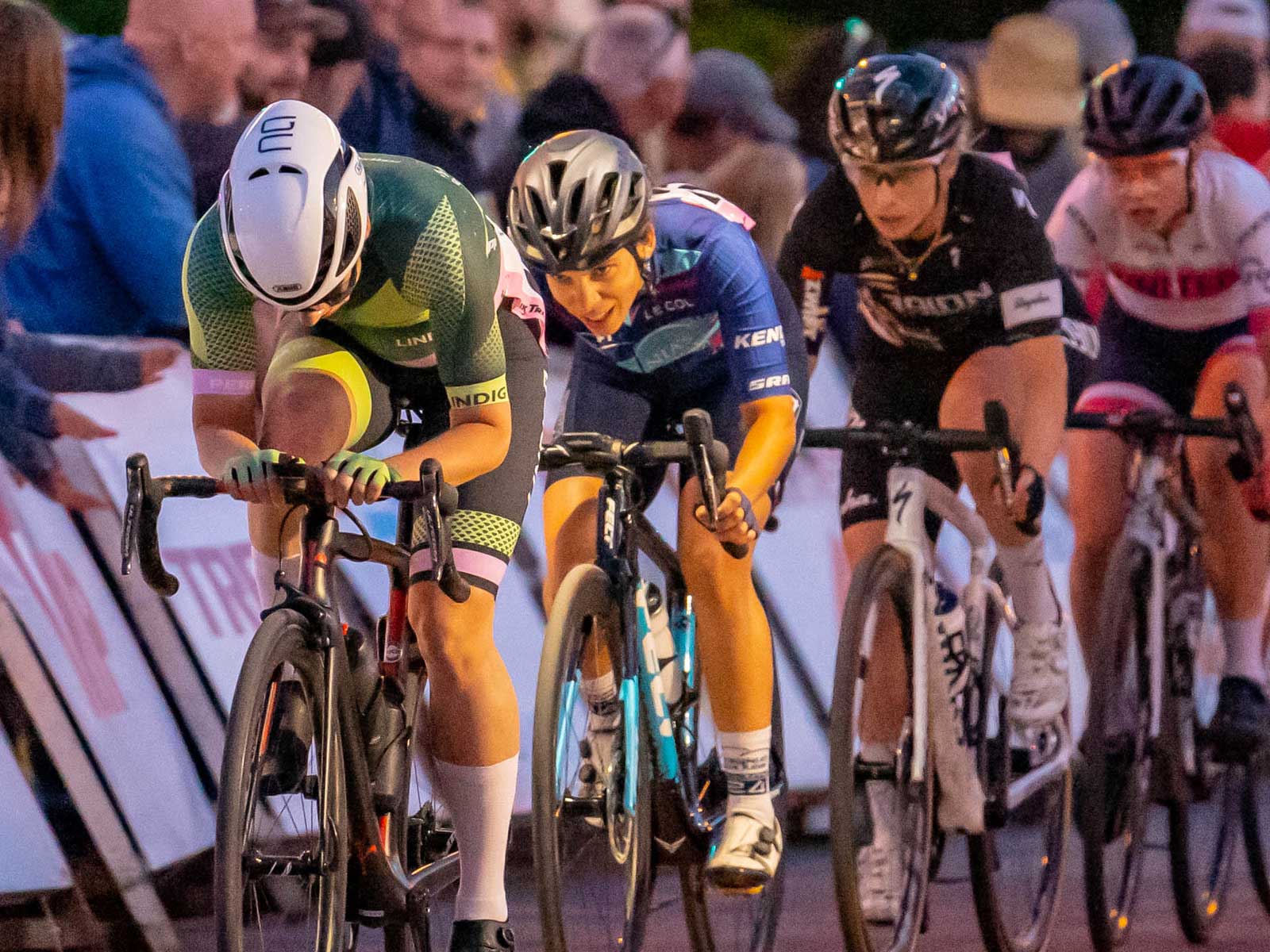 Four women drafting in a line during a crit race.