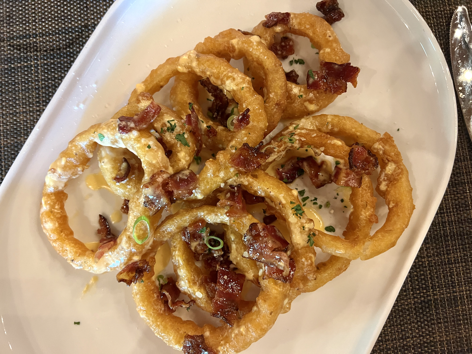 Onion Rings with beer cheese and candied bacon