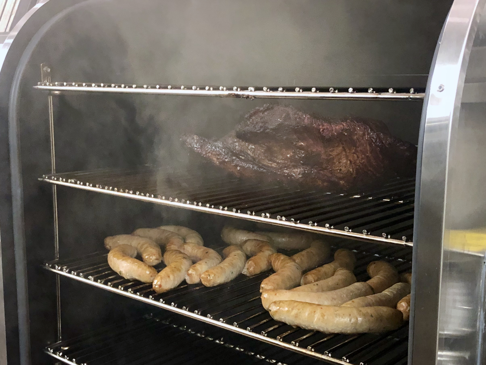 Heavens Table - meats in smoker