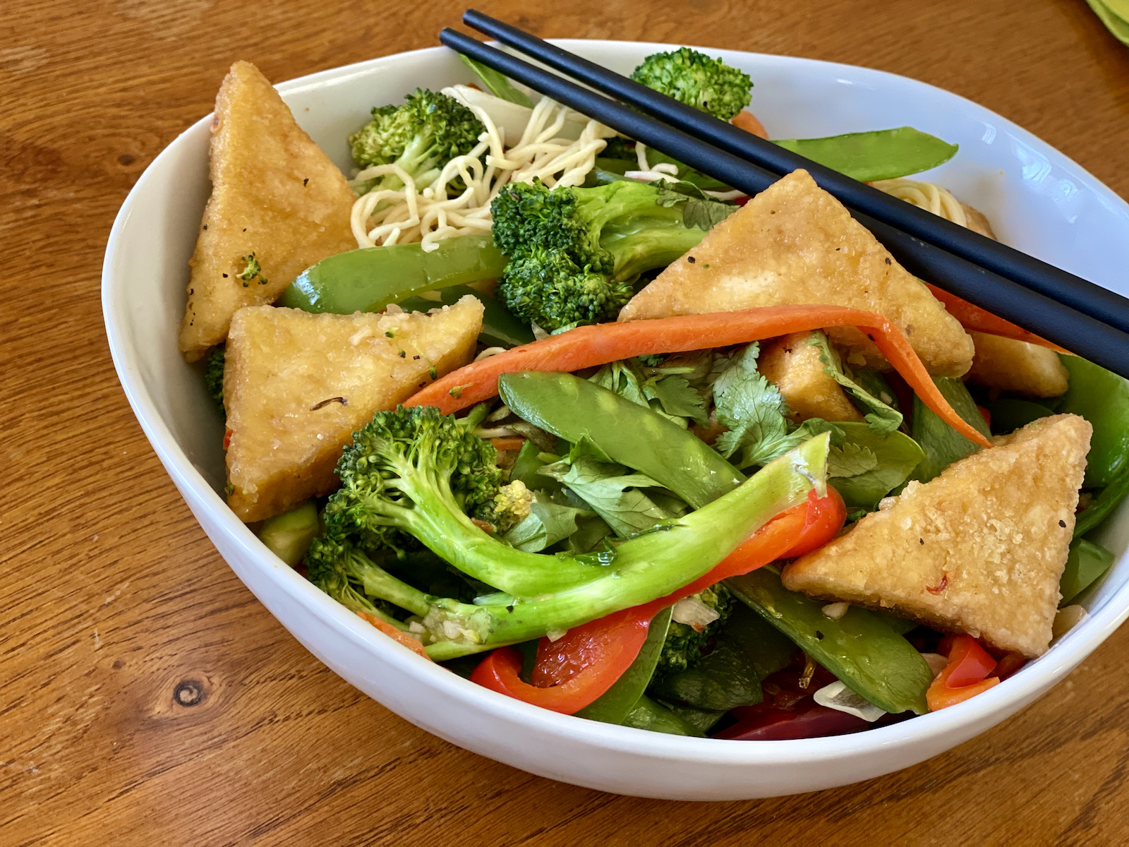 Spicy egg noodles with vegetables and tofu at Hue