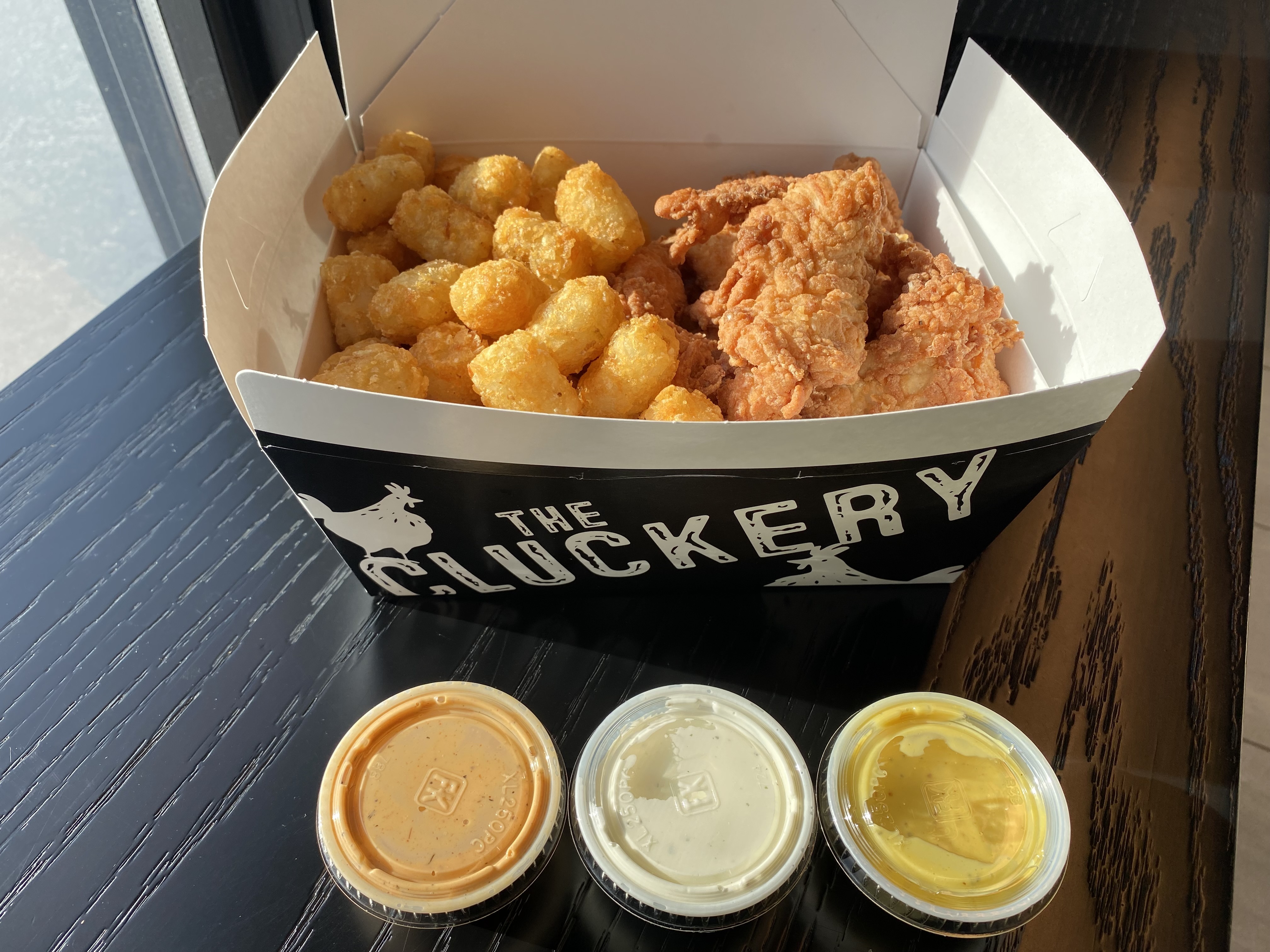 Gluten free chicken tenders, tater tots and sauces