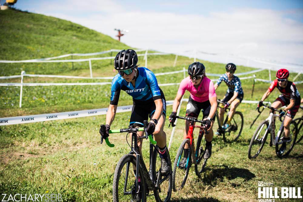 Several women competing in a cyclocross race.