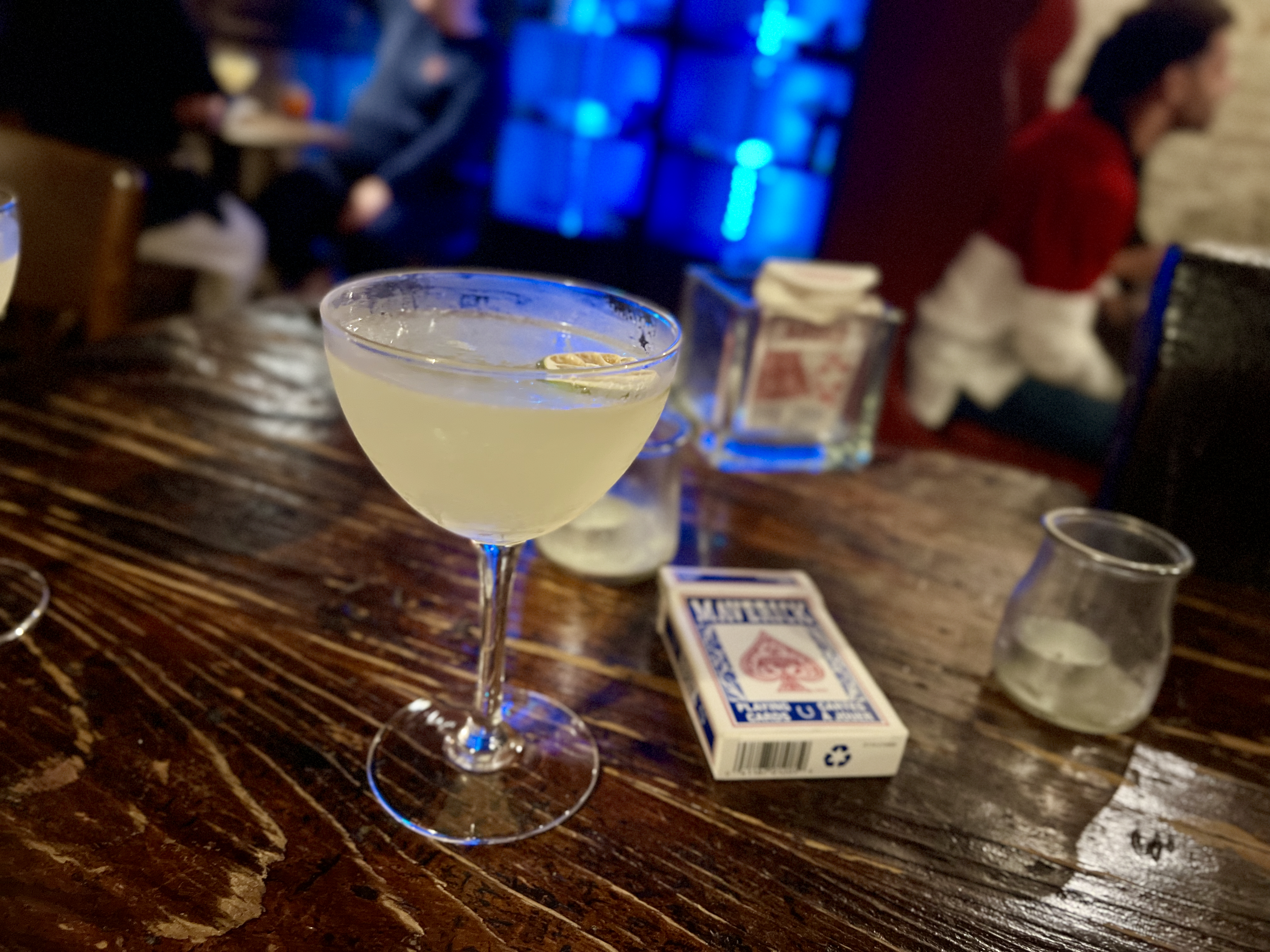 Speakeasy drink and deck of cards