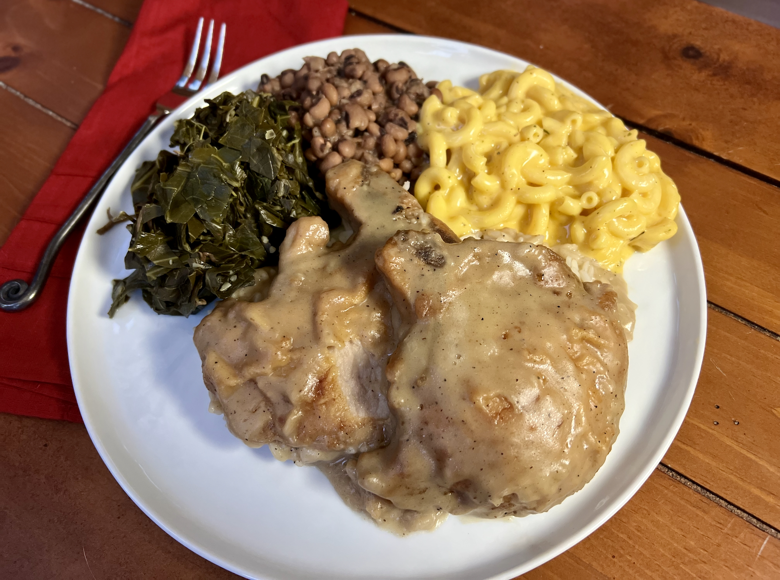 Smothered pork chops and sides from Jackson's Soul Food Redefined