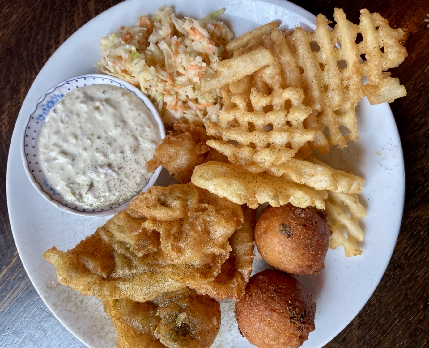 Fish fry with waffle fries, coleslaw, hush puppies