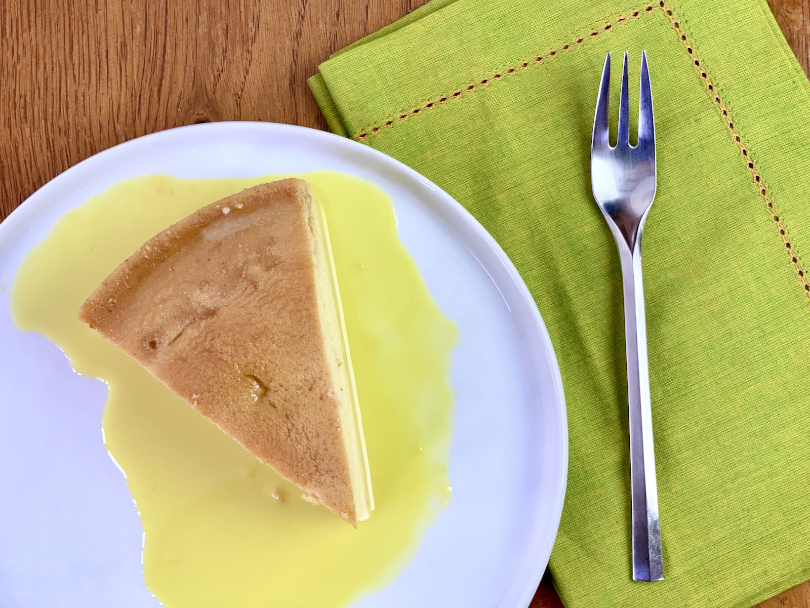 slice of flan with rum sauce