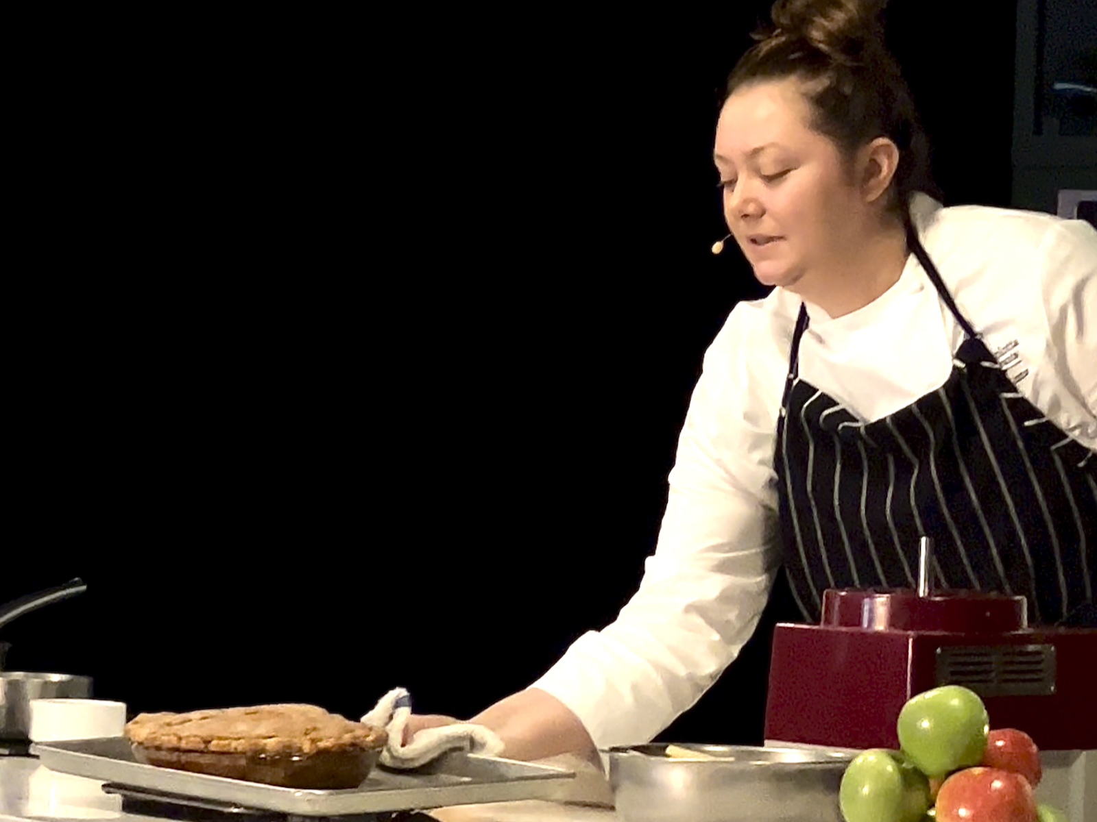 Annelise Linton takes apple pie from the oven