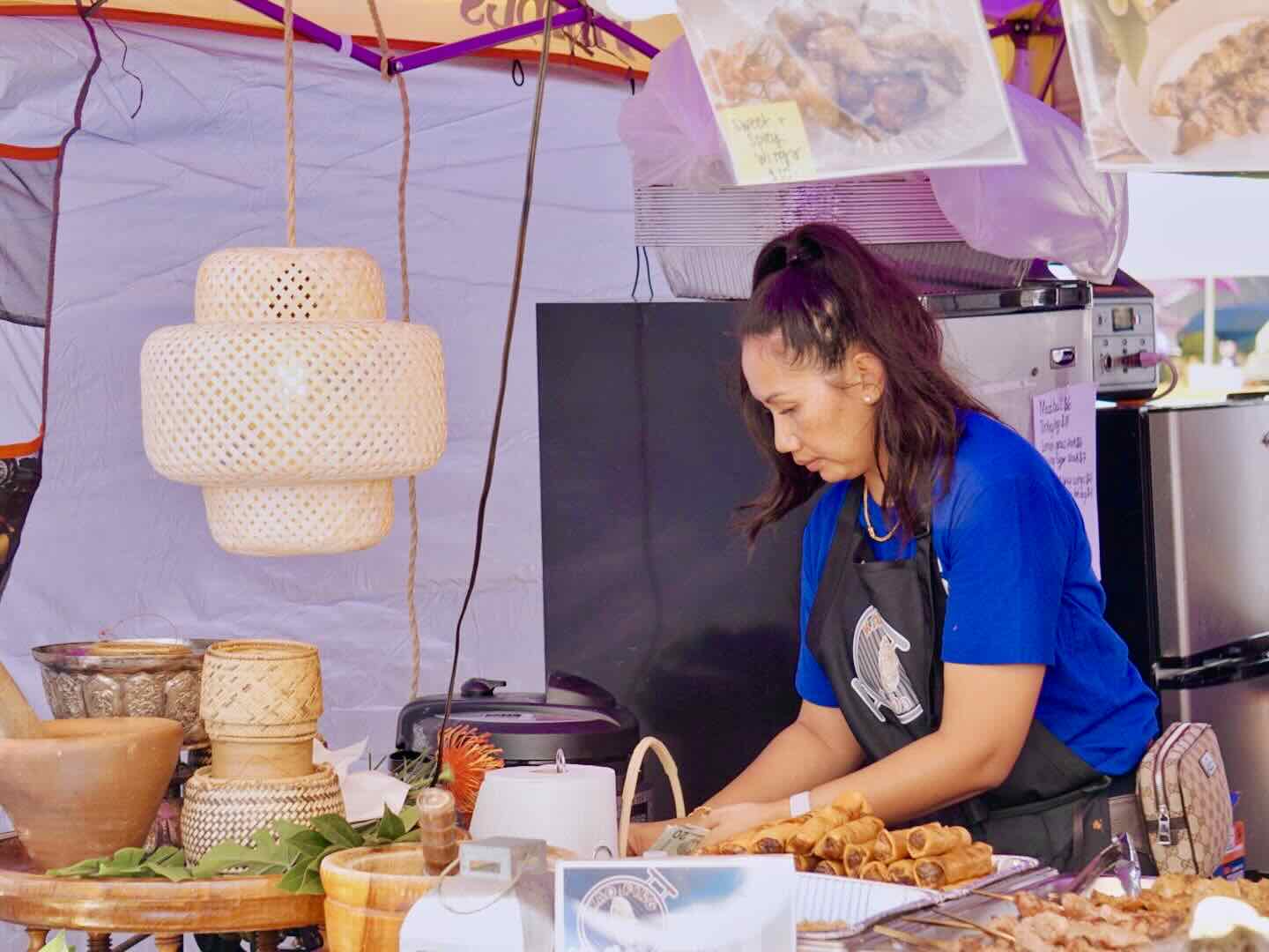 Vendor serving at Asian Night Market