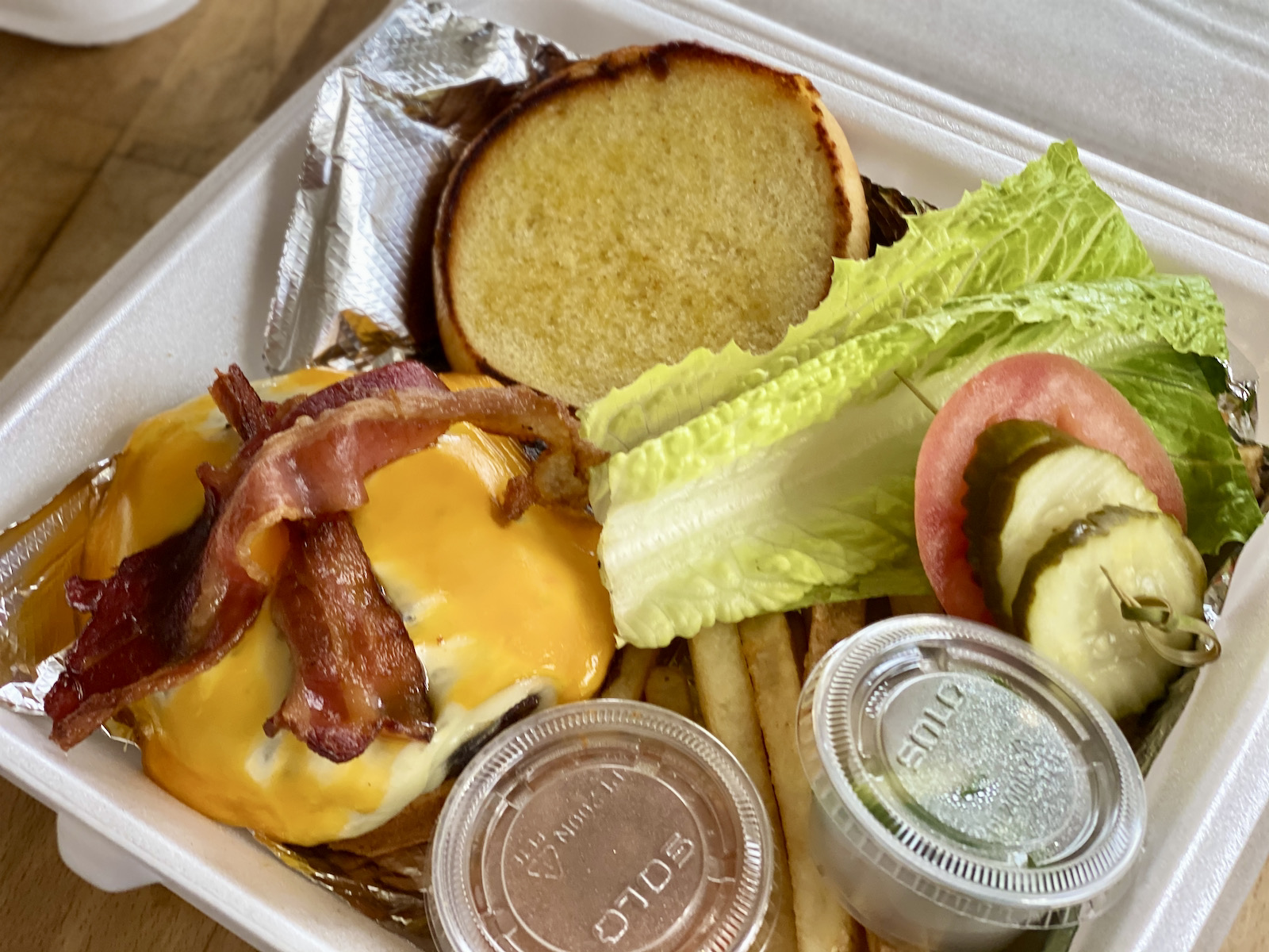 The K Ranch Burger in its carry-out packaging