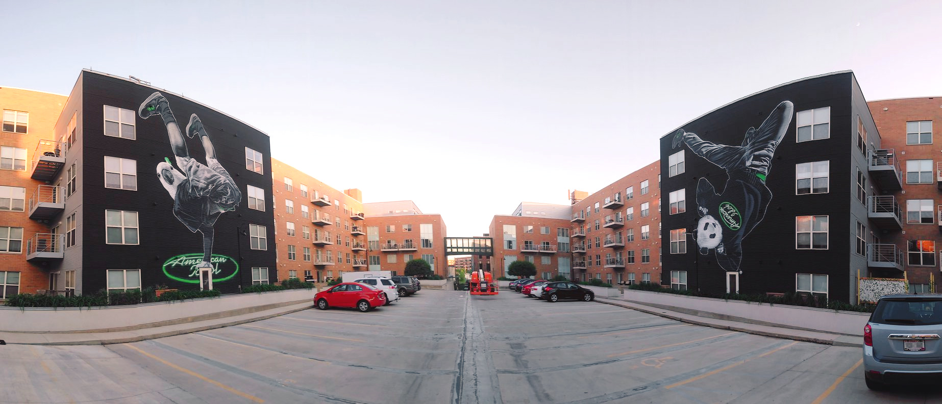 Fisheye photo of MTO's American Idol murals at New Land Enterprise's Jefferson Block apartment complex.