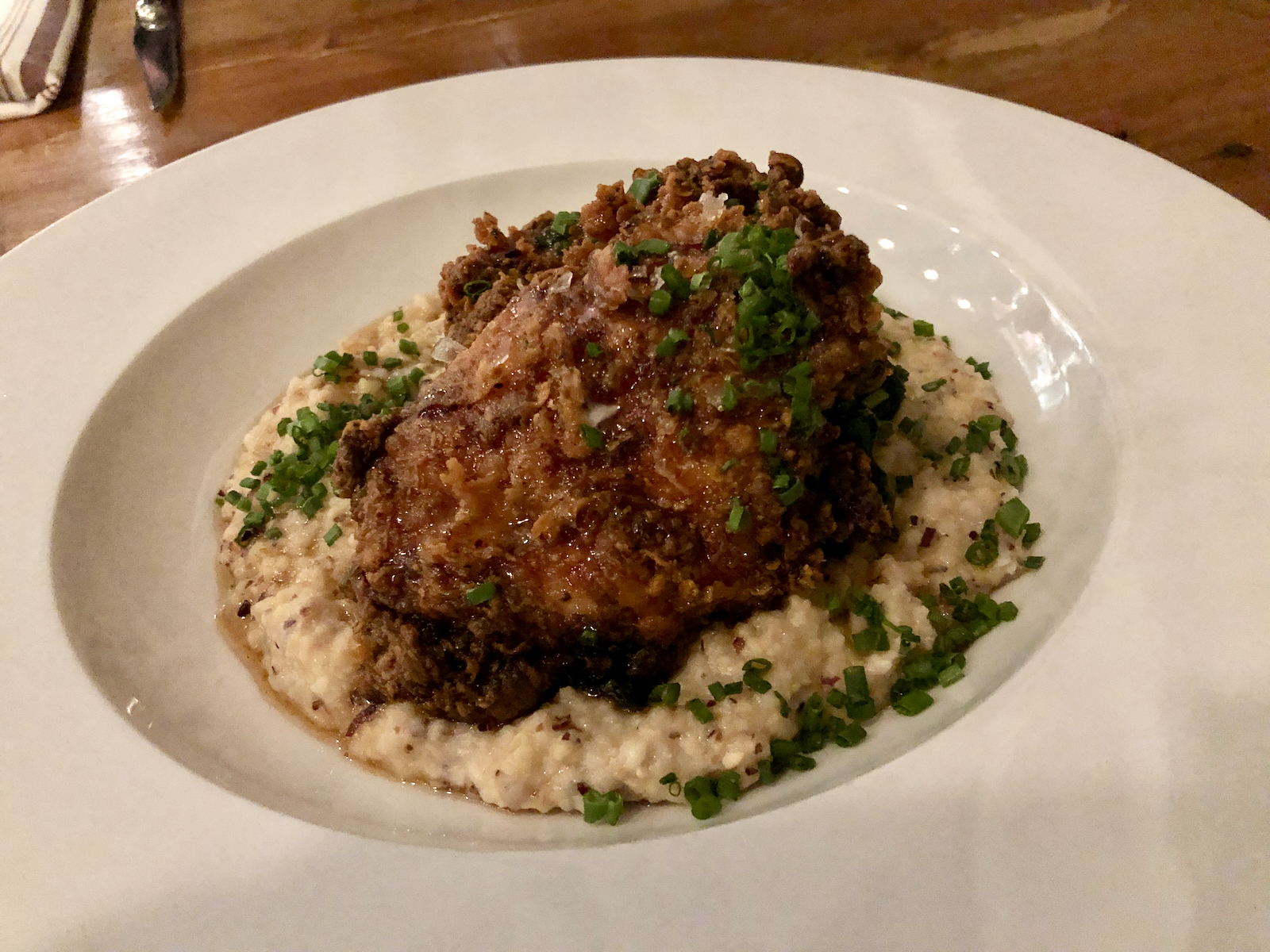 Fried chicken thigh and grits