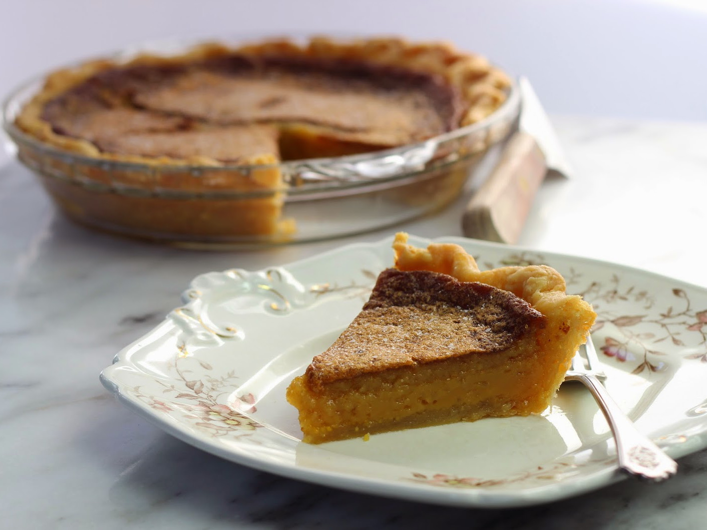 Salted honey pie,  slice and whole pie