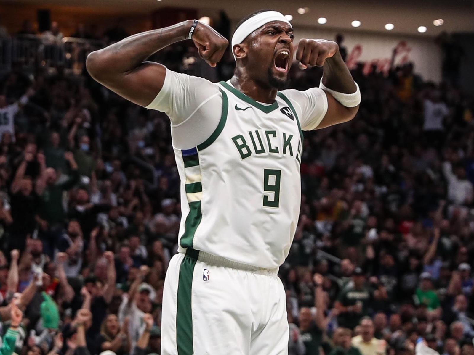 Milwaukee Bucks' Bobby Portis reacts after making a three-point