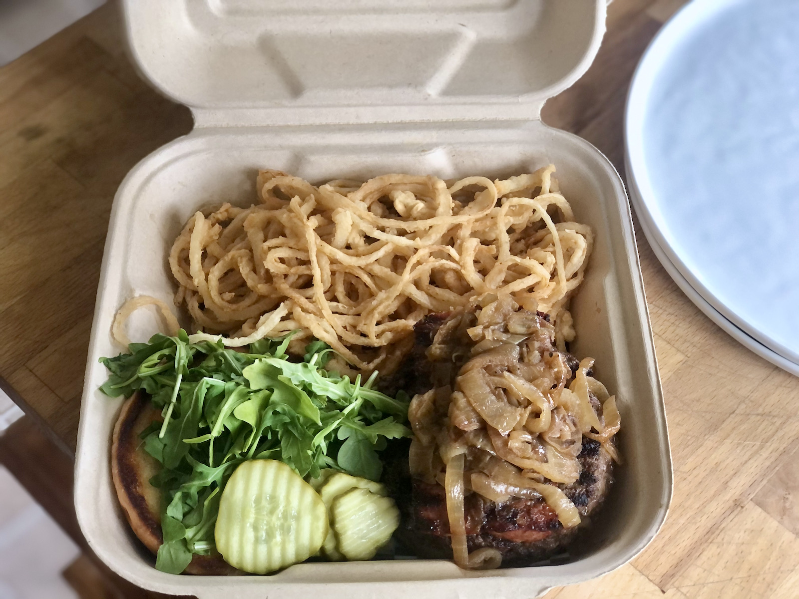 The Cajun Burger in its carry-out packaging