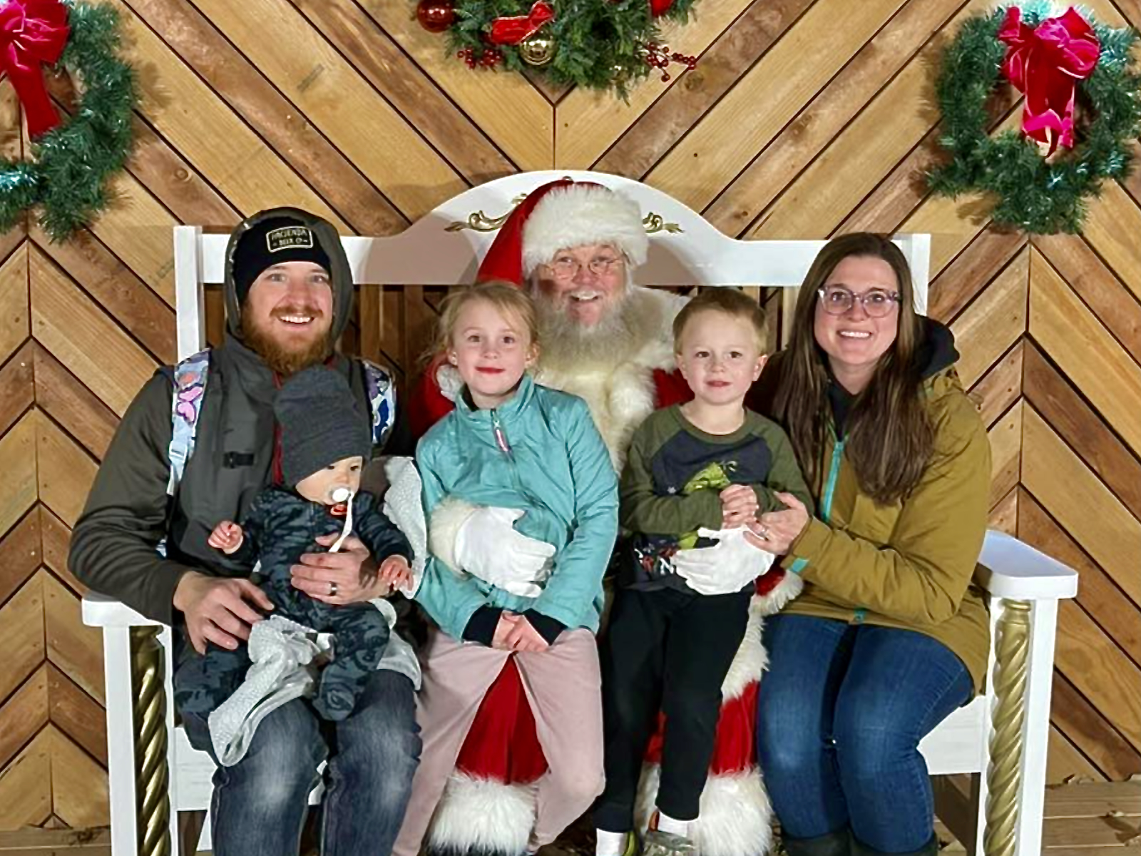 Santa taking photos with a family  (Photo: Natty Oaks)